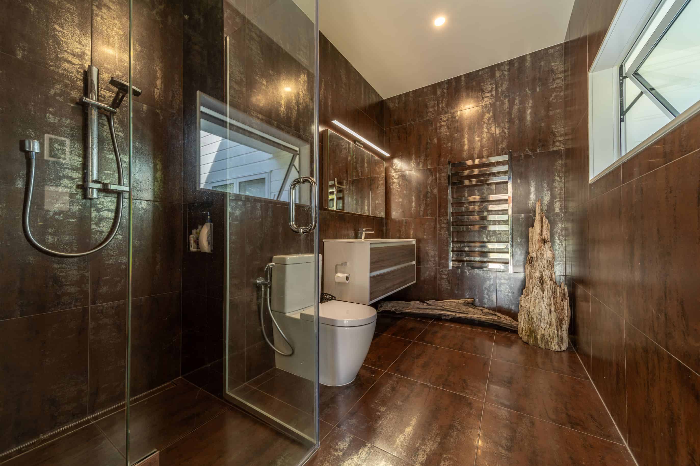 a bathroom with a toilet and a glass shower
