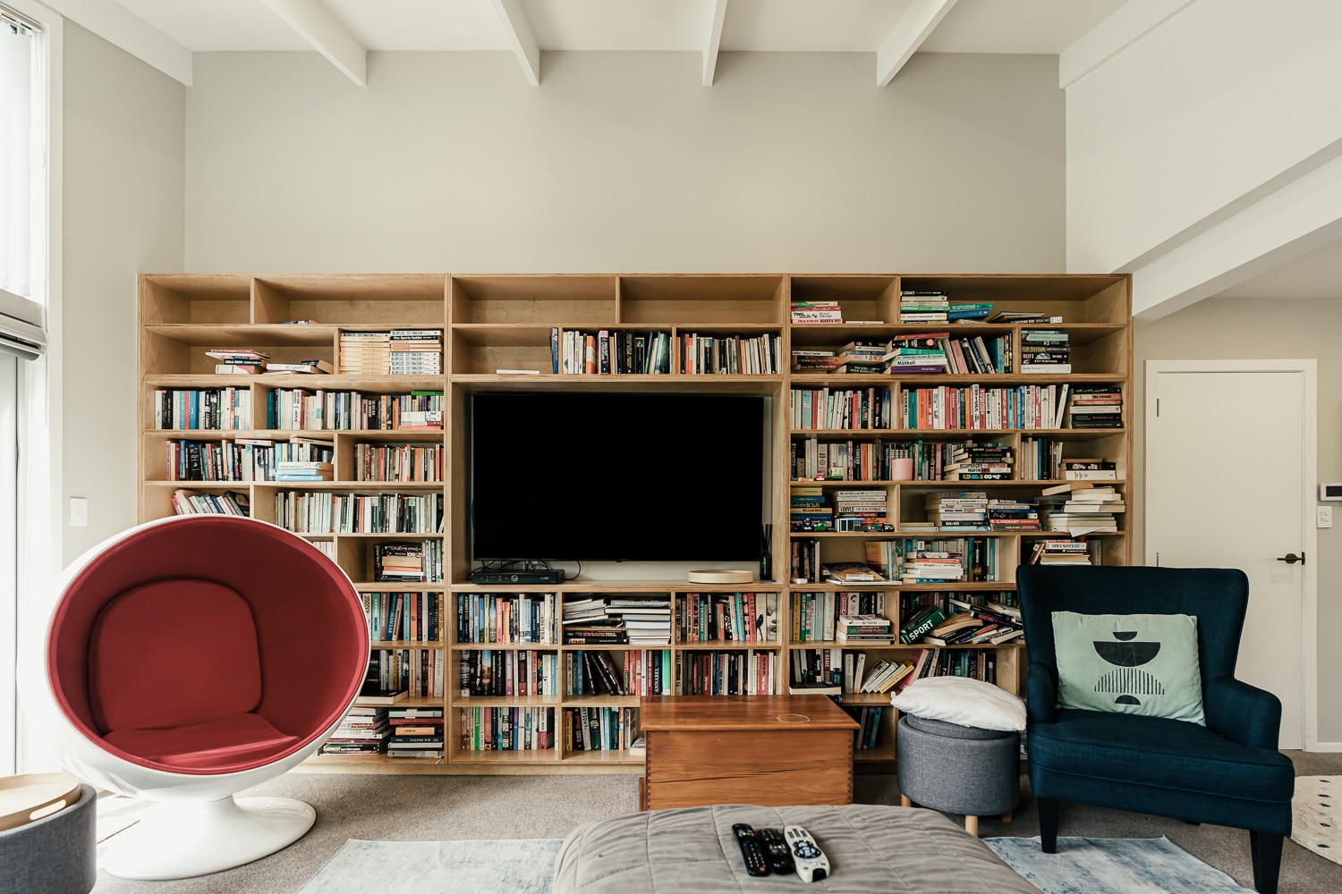 a room with bookshelves and a television